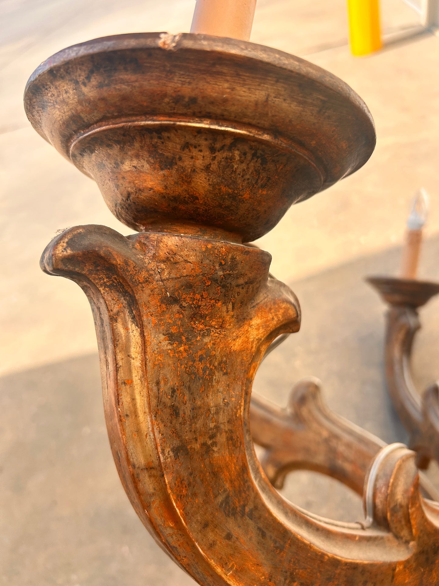 Carved arm and bobeche detail